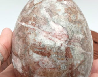 Marbled light brown polished stone egg. 4" tall