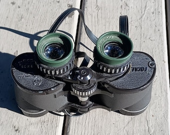 Kmart Siam cat optics. 8×35 extra wide angle 578ft at a 1000yds. Japan