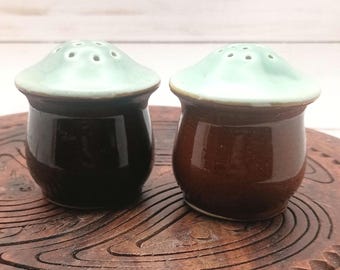 Vintage ceramic salt and pepper shakers. Cork stoppers 2.25" tall. 2.25" wide.