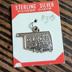 Oklahoma State silver toned bracelet charm. NOS