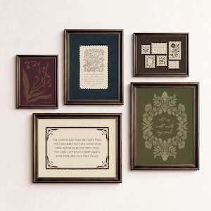 May include: A gallery wall set of five framed prints in dark bronze frames. The prints feature botanical illustrations, a bird on a branch, postage stamp motifs, and religious text including 'It is well with my soul' and 'The Lord bless thee'.