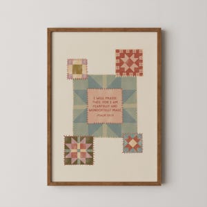 May include: A framed print with a patchwork quilt design. The central square features the text "I WILL PRAISE THEE, FOR I AM FEARFULLY AND WONDERFULLY MADE - PSALM 139:14". The design incorporates muted greens, pinks, and browns, with a wooden frame.