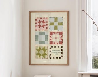 May include: A framed print featuring six quilt block designs in red, green, and blue hues. The print includes the text "FEARFULLY & WONDERFULLY MADE" in a black font. The frame is made of light brown wood.