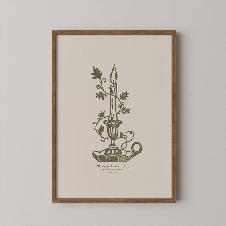 May include: A framed print depicting a candle in an ornate holder, embellished with foliage. The artwork uses green and beige tones, with the quote "Thy word is a lamp unto my feet, And a light unto my path." The frame is brown.