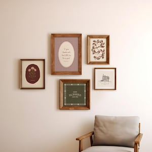 May include: A gallery wall arrangement of five wooden frames containing various prints. One features a red gingham background with the text O give thanks unto the LORD, for He is good. Another displays a green square with the text HOW BLESSED ARE WE.