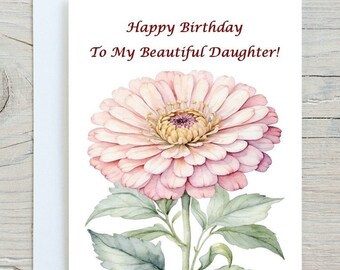 Op de afbeelding: Een aquarel-illustratie van een roze en witte zinnia met groene bladeren. De kaart staat: "Happy Birthday To My Beautiful Daughter!"
