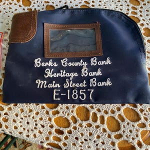 Vintage bank pouch with lock and key