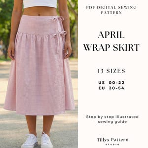 May include: A pink and white gingham wrap skirt with tie closures. The skirt is part of a PDF digital sewing pattern called "April Wrap Skirt" with 13 sizes available, US 00-22 and EU 30-54. The image also includes the text "Step by step illustrated sewing guide."