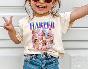 May include: Cream-colored t-shirt featuring the name "HARPER Bloom" in a gradient blue and pink font. Below the text is a collage of baby photos. The shirt is worn by a child.
