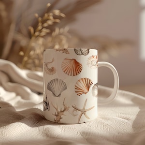 May include: White ceramic mug featuring a pattern of various seashells in shades of beige, brown, and gray. The design includes starfish, coral, and different shell types. The mug has a white handle and a smooth, glossy finish.