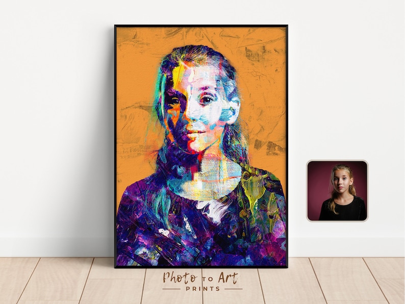 May include: A framed portrait with a vibrant, abstract painting style. The artwork features a person with colorful brushstrokes in shades of blue, purple, yellow, and green against an orange background. The text "Photo to Art PRINTS" is at the bottom.