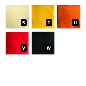May include: A grid of five fabric swatches in cream, yellow, orange, red, and black. Each square features a black rounded square icon in the bottom right corner containing the white letters S, T, U, V, and W respectively, identifying each color.