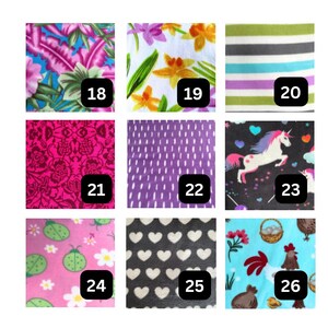 May include: A grid of nine fabric swatches labeled 18 through 26. Patterns include tropical leaves, yellow flowers, horizontal stripes, magenta floral lace, purple dashes, unicorns, ladybugs, white hearts on black, and roosters with baskets.