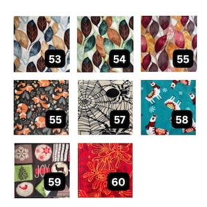 May include: A grid of eight fabric swatches labeled 53 through 60. Patterns include autumn leaves, foxes on black, a spider web, llamas on teal, holiday motifs with the text JOY, and red mistletoe. Each swatch displays a distinct graphic print.
