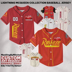 May include: A collection of red, white and cream baseball jerseys featuring Lightning McQueen from the Disney Pixar movie Cars. The jerseys have the words "Rusteze" and "McQueen" on them. The jerseys are available in kid, youth and adult sizes.