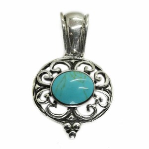 May include: A silver pendant with an oval turquoise stone at the center. The stone is surrounded by an ornate, openwork design. The pendant has a bail at the top for a chain.