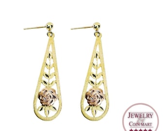 May include: A pair of gold dangle earrings with a rose design. The earrings are made of 10k gold and feature a delicate rose with leaves.