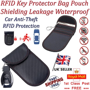 May include: Black RFID key protector pouch with a red zipper and carbon fiber pattern. The pouch has a key ring and is designed to block RFID signals. The image also shows a car key, a car, and a no signal icon.
