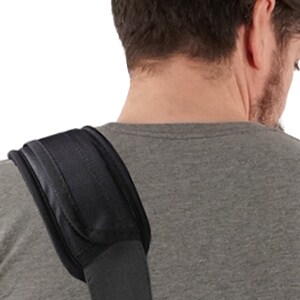 May include: A black padded shoulder strap for a bag or backpack. The strap is made of a durable material and has a comfortable design.