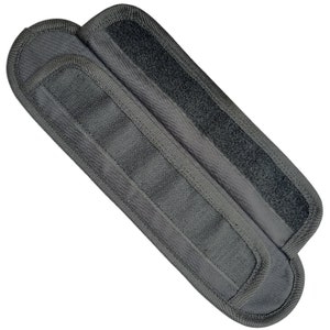 May include: Two black nylon straps with hook and loop fasteners. The straps are designed to be used as a belt or strap extension.