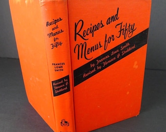 May include: An orange cookbook titled "Recipes and Menus for Fifty" by Frances Lowe Smith. The book's cover features black text and a black diagonal stripe. The spine reads "Recipes and Menus for Fifty" and lists the author and reviser.