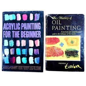 May include: Two vintage art instruction books. One is titled "Acrylic Painting for the Beginner" with colorful paint swatches. The other is "The Mastery of Oil Painting" with a colorful abstract painting on the cover.