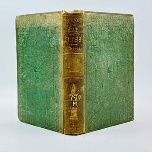 May include: An antique book with a green cover and gold spine. The book's cover is embossed with a geometric pattern. The spine features the title "Science of Chess" and the number "794". The book is likely a vintage edition.
