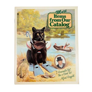 May include: A vintage Avon catalog cover featuring a black cat wearing a diving mask, snorkel, and flippers. The cover includes the text "More Items from Our Catalog" and a portrait of a man in a hat. The catalog is titled "Book Two" by Alfred Gingold.