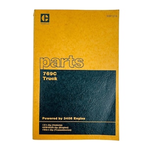 May include: A yellow and black parts manual for a 769C truck. The cover features the Caterpillar logo and the word "parts" in large letters. The manual is powered by a 3408 engine and includes information for the vehicle, engine, and transmission.