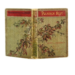 May include: A white ceramic mug with a black handle and the text "But First, Coffee" in a black, bold font. The mug is on a white surface.