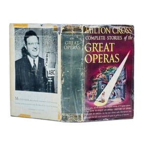 May include: Vintage book titled "Complete Stories of the Great Operas" by Milton Cross. The cover features a photo of a man with a microphone and the ABC logo. The book has a maroon cover with a spotlight illustration.