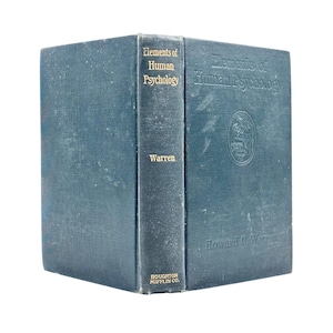 May include: A vintage, teal-colored book titled "Elements of Human Psychology" by Warren. The book's spine features gold lettering and the publisher's name. The cover has an embossed design and the author's name.
