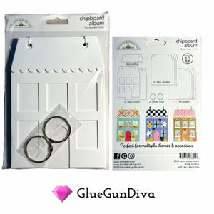 May include: A white chipboard house-shaped album with 8 photo openings, 2 binder rings, and a sheet of instructions. The instructions show how to assemble the album and include images of different themed houses.
