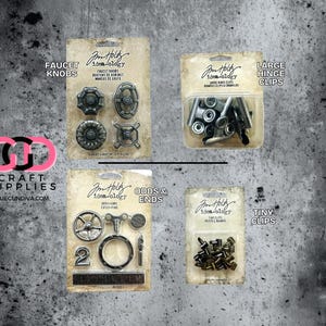 May include: A collection of craft supplies, including faucet knobs, large hinge clips, odds & ends, and tiny clips. The products are packaged on cards with the "idea-ology" brand name. The background is a textured gray surface.