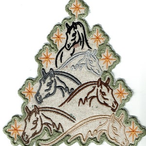 May include: Embroidered patch featuring a triangular design with multiple horse heads in shades of black, gray, and brown. The patch has a light beige background and is framed by a green border with gold star accents. The patch is likely for clothing or accessories.