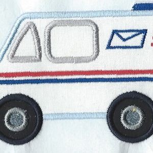 May include: A white mail truck with red, white, and blue stripes, a blue roof, and a mailbox on the side. The truck has two black wheels and a gray window.