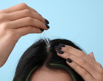Haargroeiserum met zwarte zaadolie