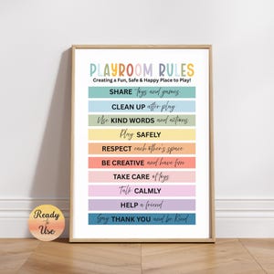 May include: A framed playroom rules poster with a wooden frame. The poster features colourful text on a white background, including "SHARE toys and games" and "CLEAN UP after play". A circular sticker with "Ready to Use" is in the lower left corner.