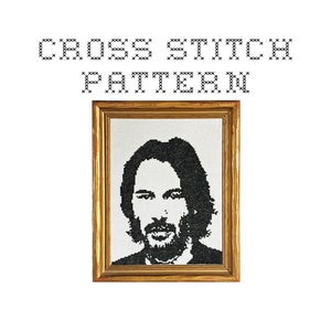 May include: Cross stitch pattern of a black and white portrait of a man with long hair and a beard, framed in a gold frame. The text "CROSS STITCH PATTERN" is above the image.