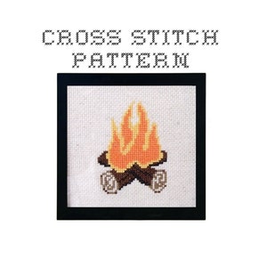 May include: Cross stitch pattern of a campfire with orange and yellow flames and brown logs. The pattern is framed in a black frame.