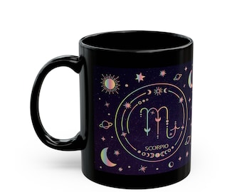 May include: Black ceramic mug with a colorful illustration of the Scorpio zodiac sign surrounded by stars, moons, and planets. The text "SCORPIO" is printed below the sign.