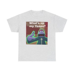 May include: A gray t-shirt with a blue puppet character on it. The puppet is saying "What's up my Yeeps?" in a green font.