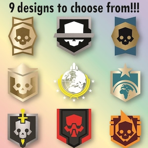 May include: Nine decal designs featuring various shield and emblem shapes with skull, globe, and sword motifs. Text reads: Danielle's Sweet Decals, 9 designs to choose from!!!, and Various pairs of colors are shown by default, but you have over 130 colors to choose from!!