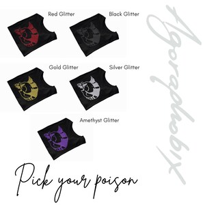 May include: Five black t-shirts with a graphic of a stylized animal on the front. The shirts are available in red, black, gold, silver, and amethyst glitter.