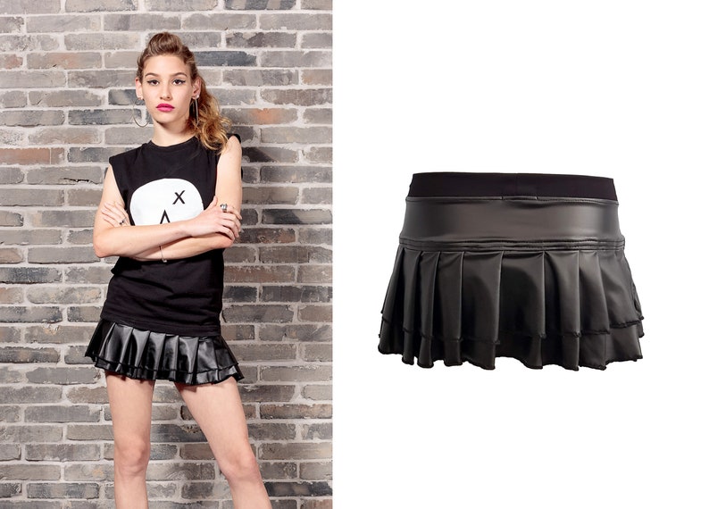 May include: A black faux leather mini skirt with a pleated design and a black waistband.