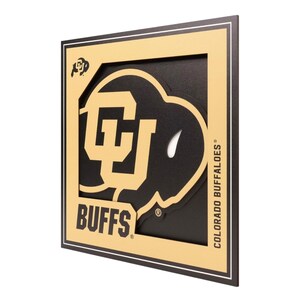 May include: A square, layered wall art piece featuring the Colorado Buffaloes logo. The design includes a black background, a gold-colored border, and the team's logo in gold. The word "BUFFS" is displayed.