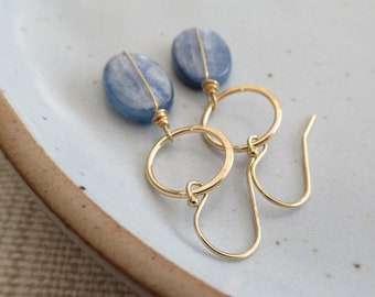 Denim blue earrings, Smooth oval wire wrapped kyanite stones drop from gold hoops, Modern geometric circles, Casual gold dangle earrings