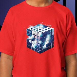 May include: Red t-shirt with a graphic of a blue and white cube with a pixelated design.