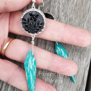 Artisan earrings feature antique black buttons set in sterling silver with Amazonite dangles.  Long earrings