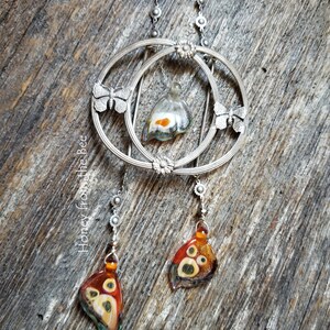 One of a kind butterfly necklace features antique buckle and lampwork butterfly wings.